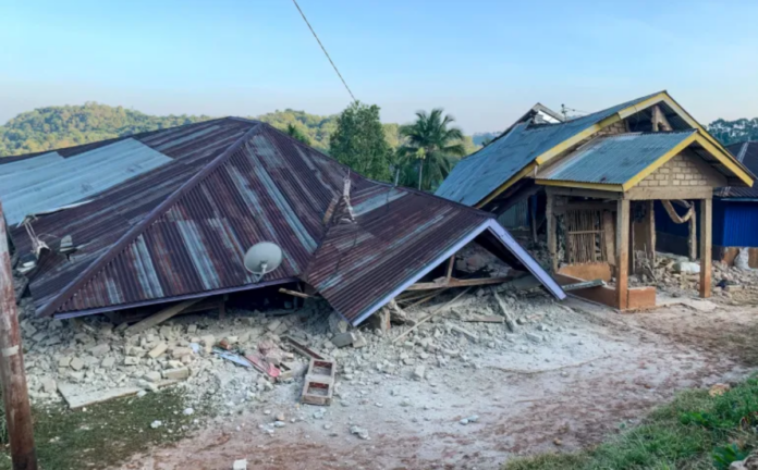 Damaged houses on Indonesia following a magnitude 7.7 earthquake on August 15